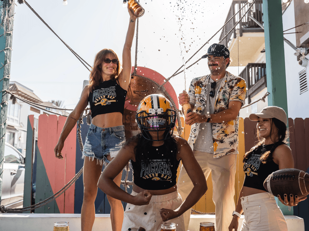 Green Bay Packers fans toasting at Miss B's Coconut Club entrance Mission Beach San Diego