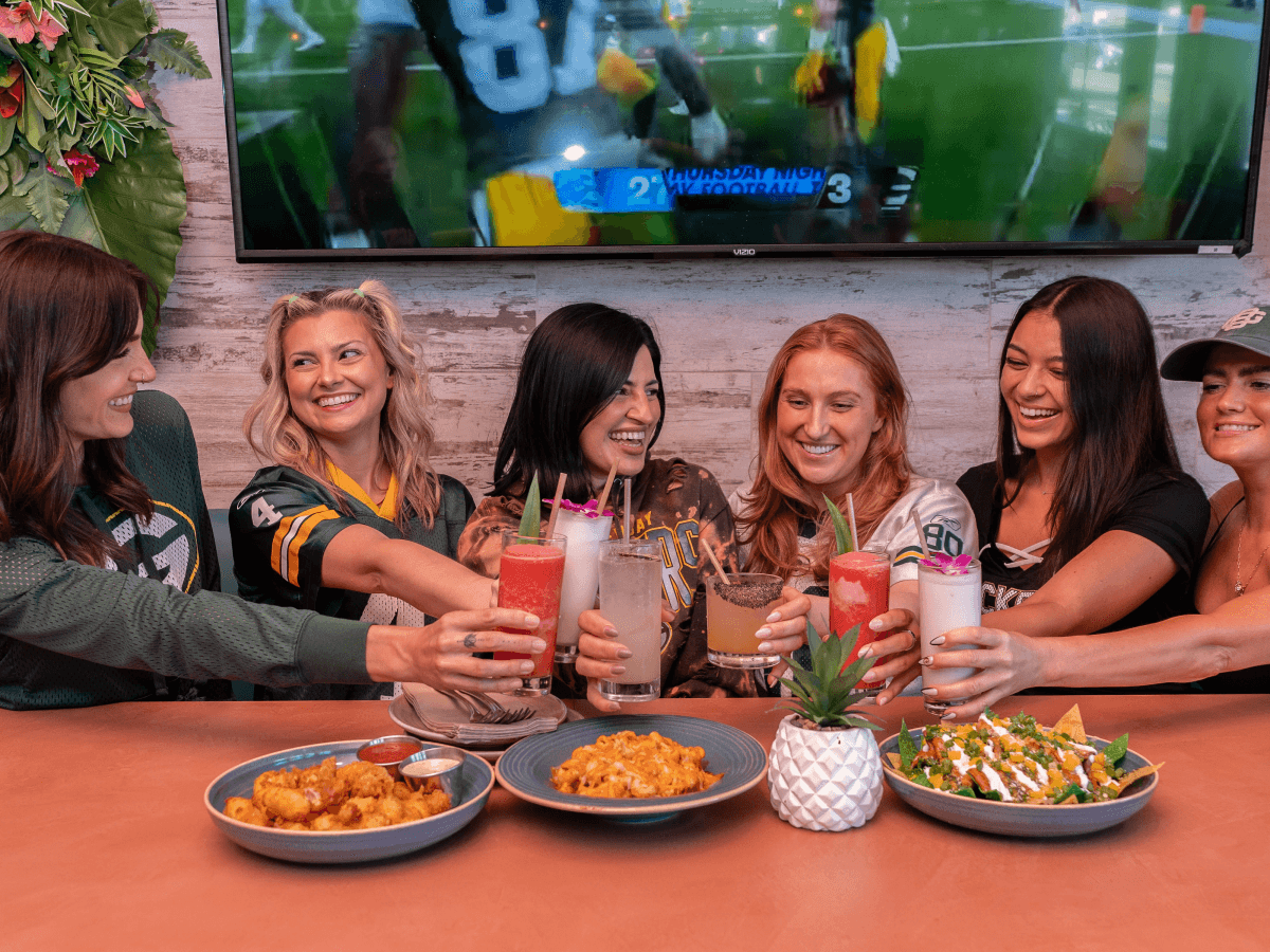 Green Bay Packers fan in helmet at Miss B's Coconut Club Mission Beach San Diego