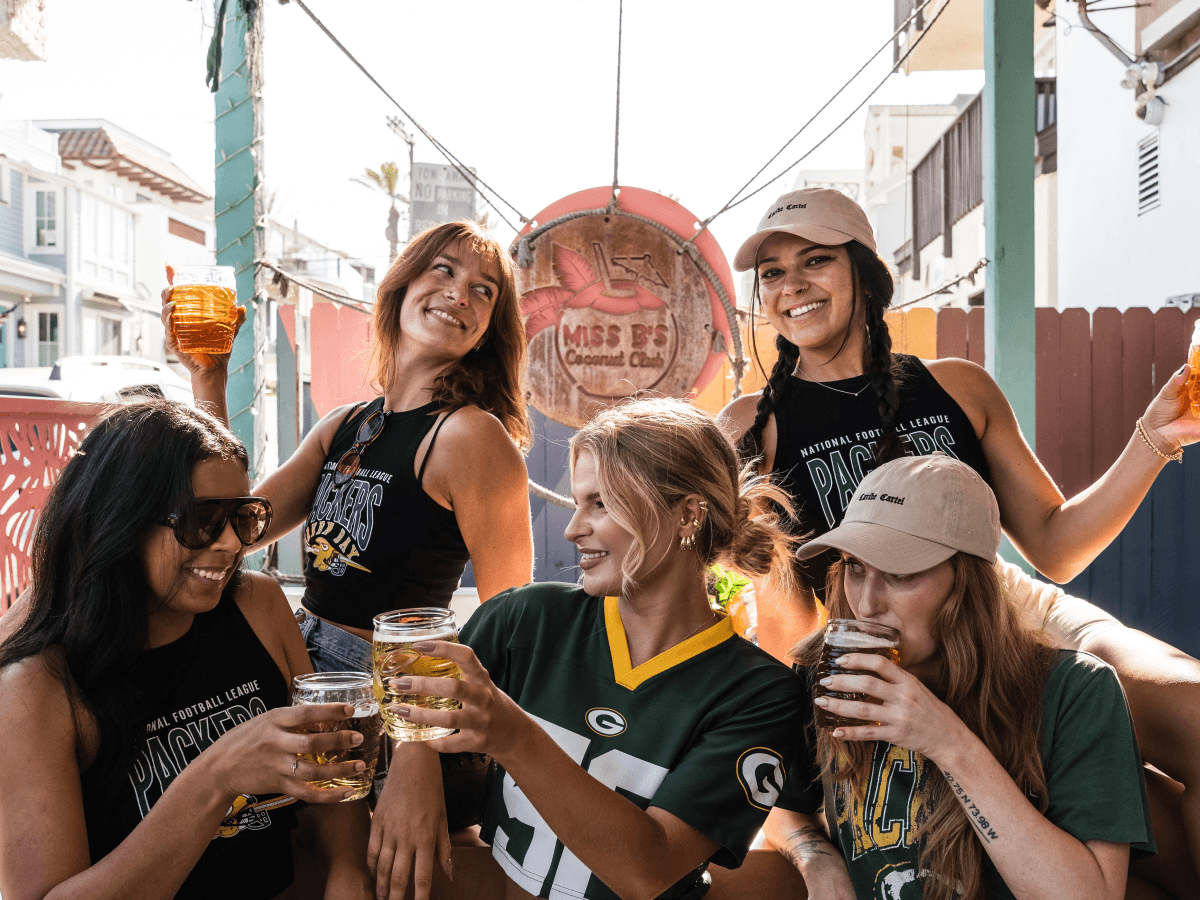 Green Bay Packers fans posing at Miss B's Coconut Club Mission Beach San Diego