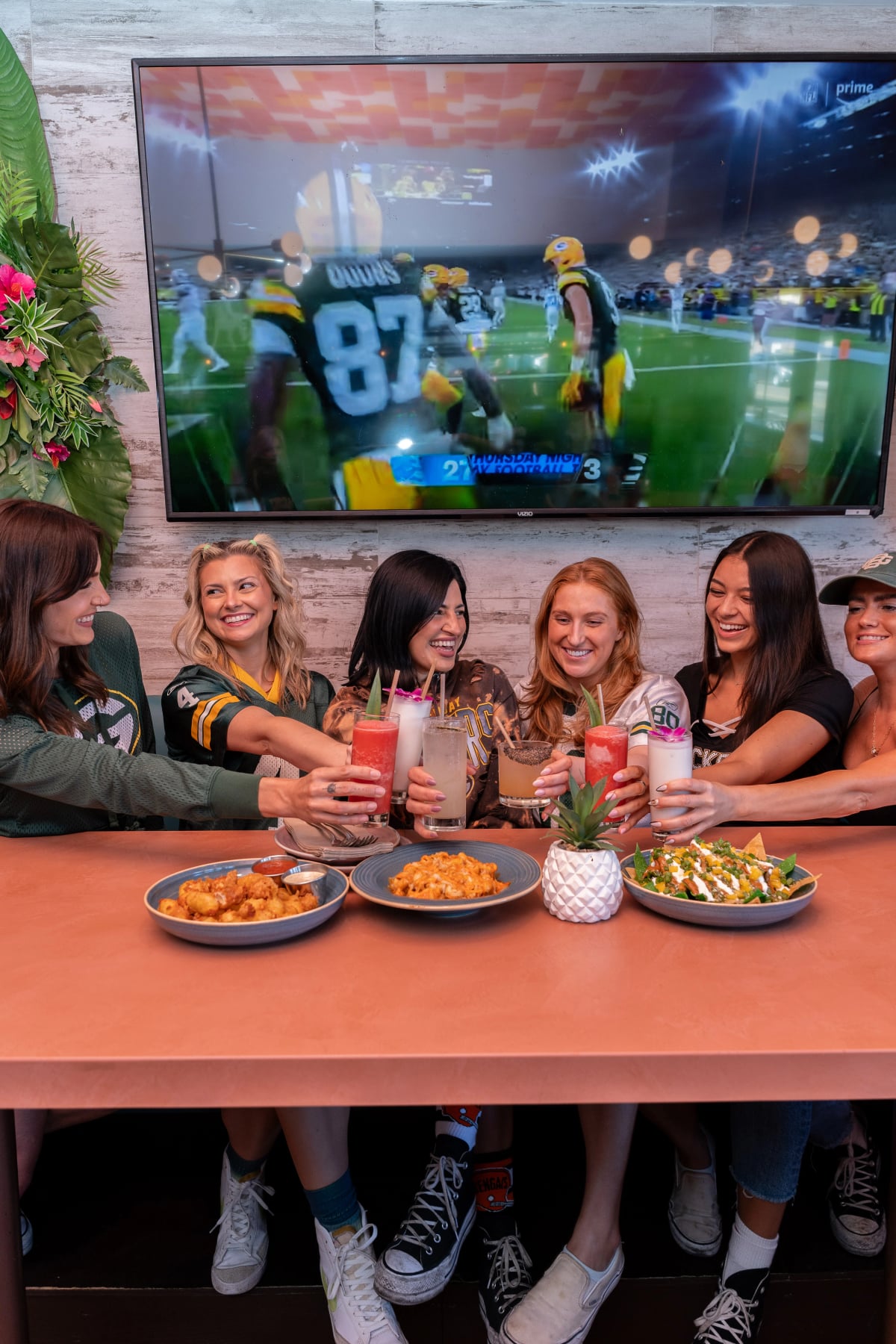 Green Bay Packers fan in helmet at Miss B's Coconut Club Mission Beach San Diego