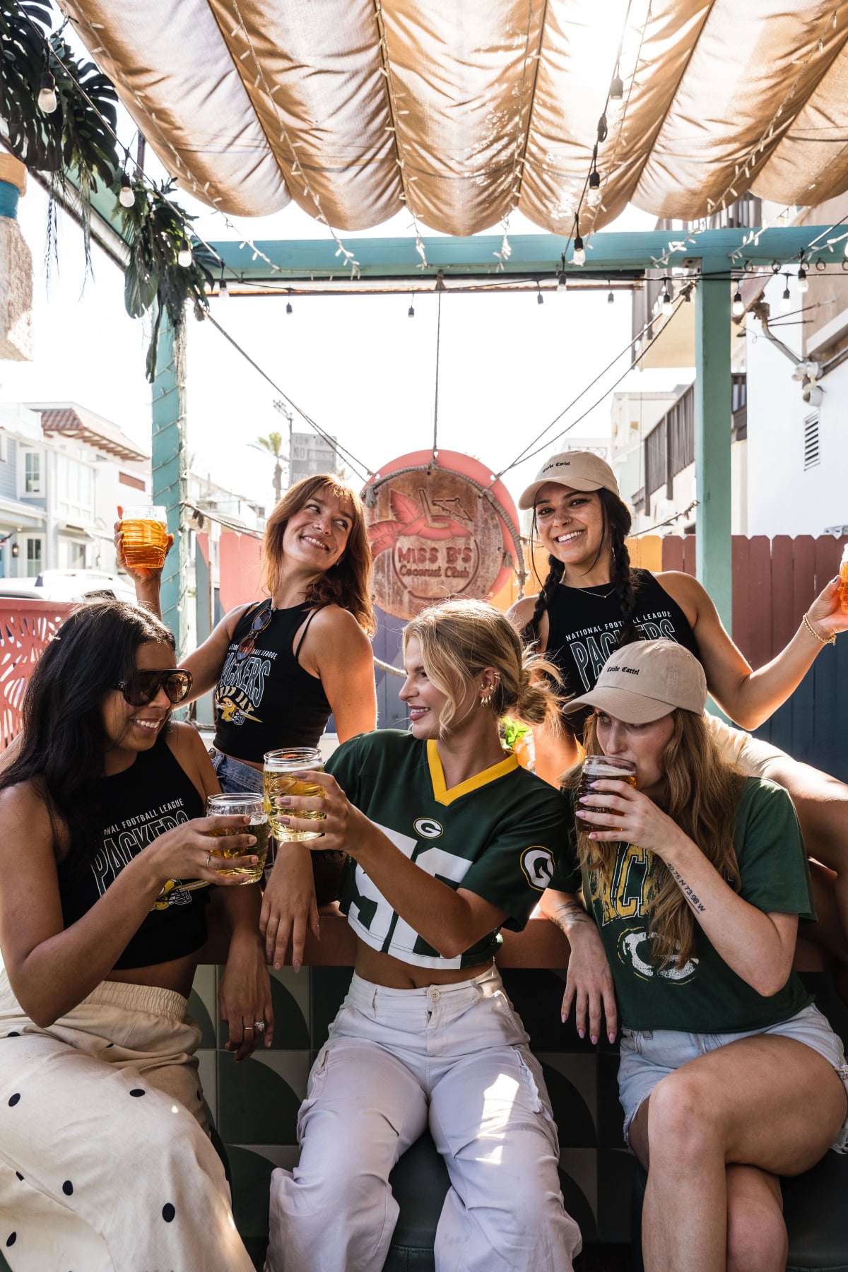 Green Bay Packers fans posing at Miss B's Coconut Club Mission Beach San Diego